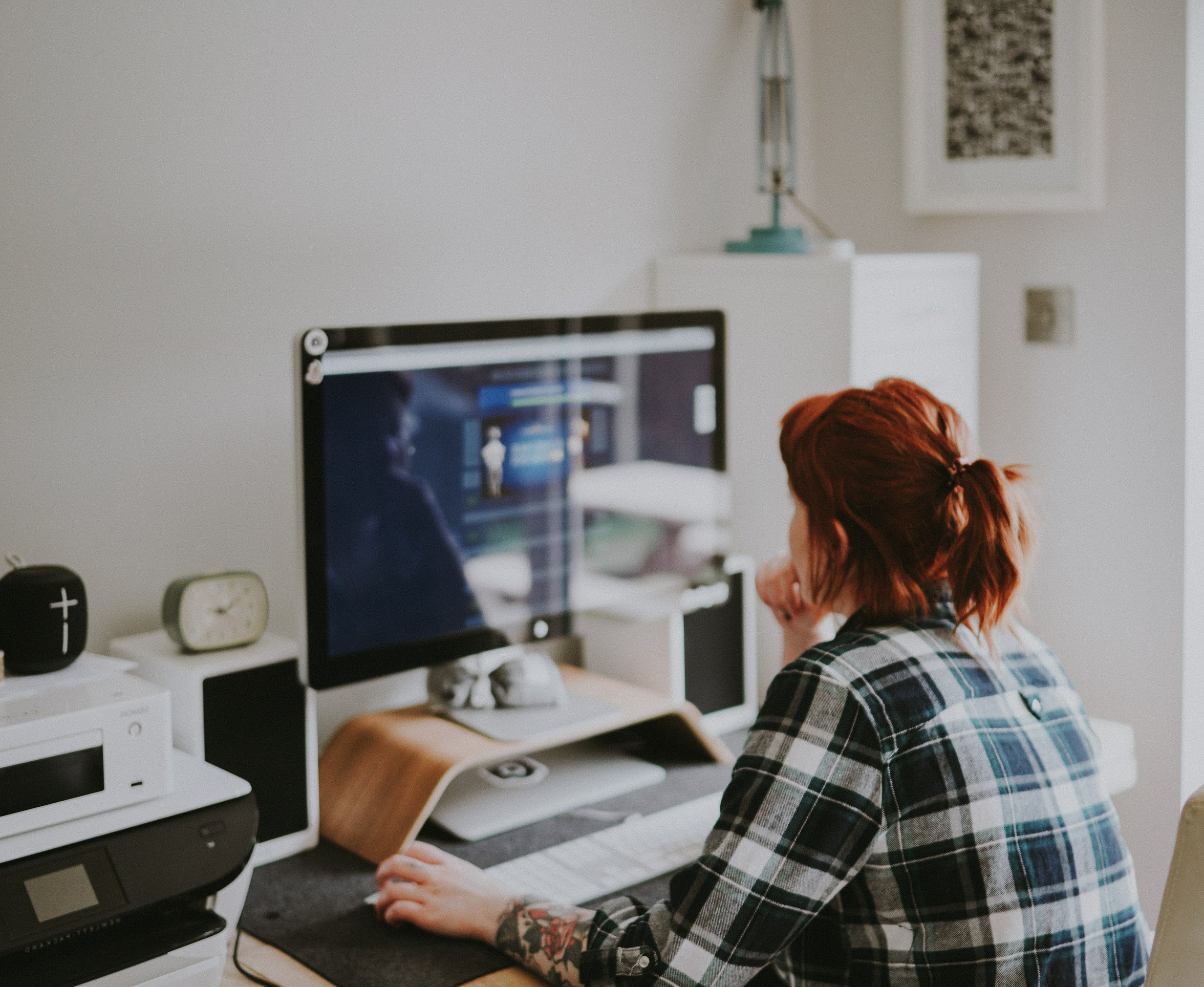 Tattooed Woman Working on Her Desk