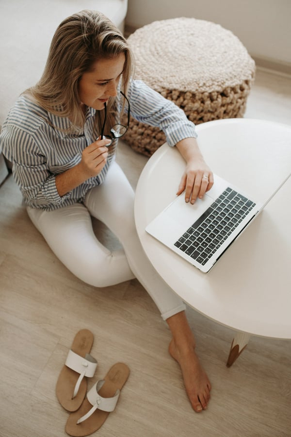 Woman Using Laptop at Home